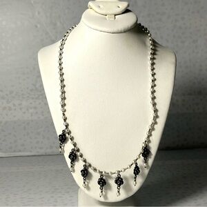 Bettina Duncan 16” Silver Dangling Flower Charm Necklace